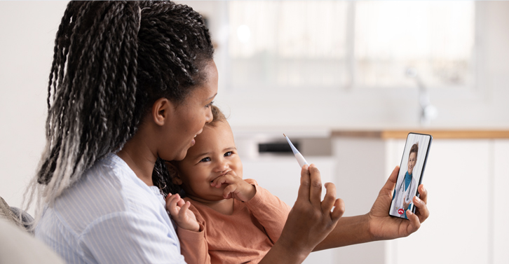 Woman and child looking at phone